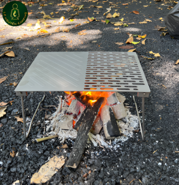 The grill has folding legs for camping and picnic travel Made In Vietnam 3