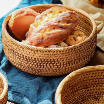 Hand woven basket rattan, bamboo, water hycinth, seagrass basket for holding bread and fruit, objects. Fashionable