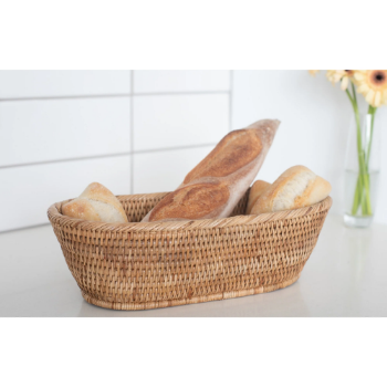 Hand woven oval rattan, bamboo, water hycinth, seagrass basket for holding bread and fruit, objects. Fashionable design
