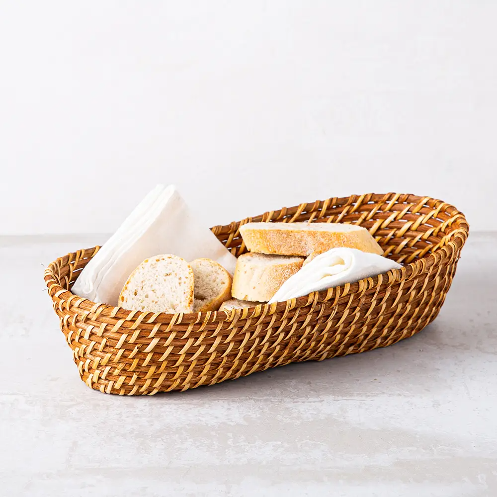 Hand woven oval rattan, bamboo, water hycinth, seagrass basket for holding bread and fruit, objects. Fashionable design 1